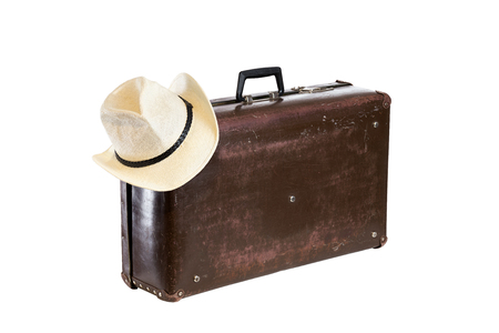 old brown fiber suitcase with hat isolated on white backgroundの写真素材