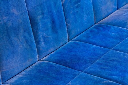 dusty blue sofa surface with palm prints closeup with selective focusの写真素材