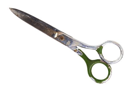 Single old soviet dirty used scissors isolated on white background. Closed.