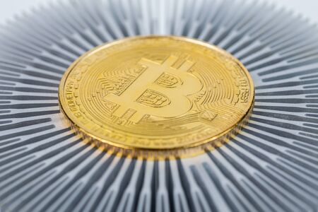 Bitcoin shiner close-up on aluminium heatsink with selective focusの写真素材