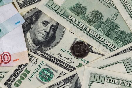 us dollars and russian rubles close-up background with selective focus