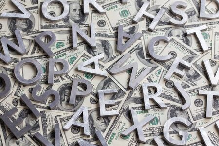 A random metal letters on us dollar backgroundの写真素材