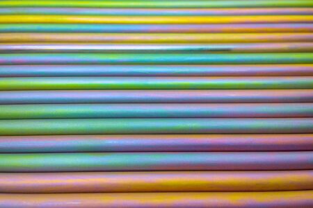 An abstract lines backround of colorful cadmium coated steel bars. Horizontal orientation with selective focus.の写真素材