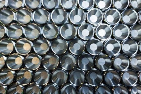 a batch of shiny metal cnc aerospace parts production - close-up with selective focus for industrial background in flat lay compositionの写真素材