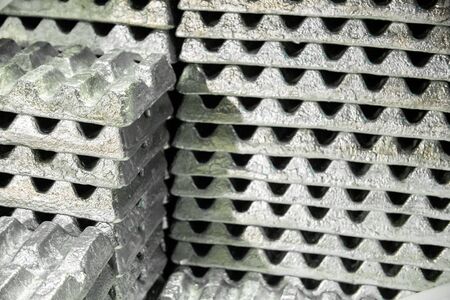 stack of aluminium ingots - close-up with selective focus