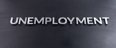 the word unemployment laid with aluminium letters on matte black flat surfaceの写真素材