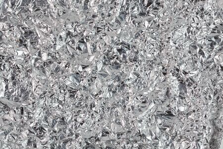 crumpled aluminium foil flat background and texture
