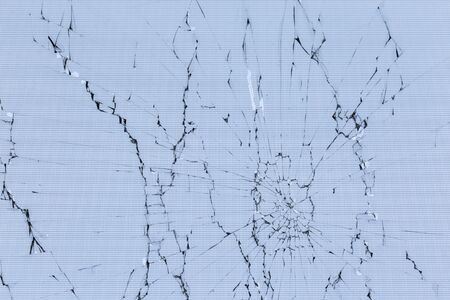 flat texture of cracked glass tft lcd screen with localized radial cracks