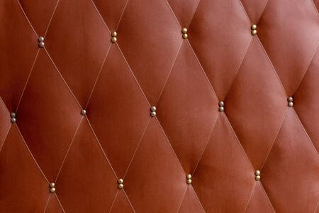 Soviet soft brown dermantine front door with a banner of fishing line and nails - full frame background and textureの写真素材