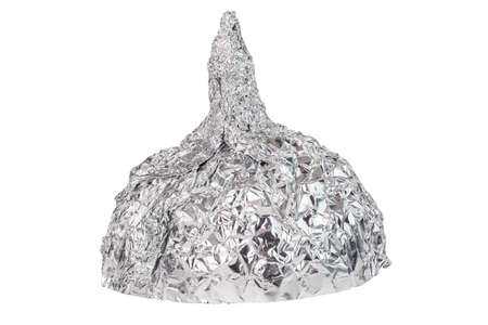Aluminium foil hat isolated on white background, symbol for conspiracy theory and mind control protection.の写真素材