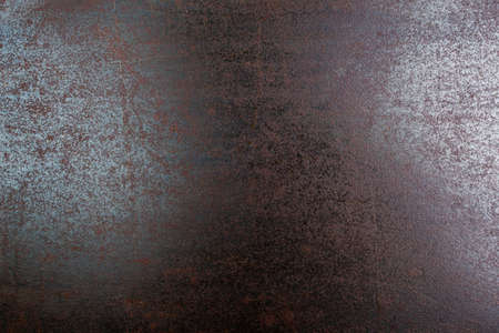 rusted black steel sheet surface covered with machine oil