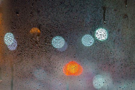 an abstract background of night wet window glass