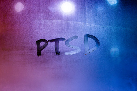 abbreviation ptsd - post traumatic stress disorder - handwritten on night wet window glassの写真素材
