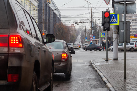 TULA, RUSSIA - NOVEMBER 21, 2020: Winter daytime street cars and pedestrians traffic at cross roadsのeditorial素材