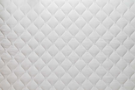 Soft white mattress flat background and texture.