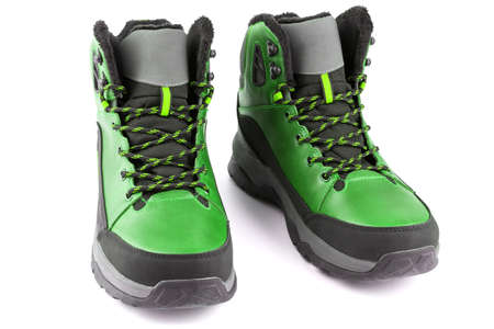 pair of green insulated winter warm three quarter sneaker or boot isolated on white background