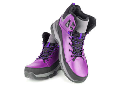 pair of pink insulated winter warm three quarter sneaker or boot isolated on white backgroundの写真素材