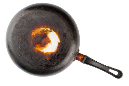 old stained aluminium pan with burnt fat - bottom up flat lay isolatedの写真素材