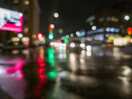 defocused night rain city street cross roads viewの写真素材