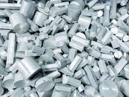 heap of short leftovers of hexagonal and round long products of steelの写真素材