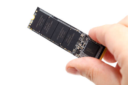 caucasian hand holding NVME M.2 SSD 2280 3Dnand SLC drive stick isolated on white