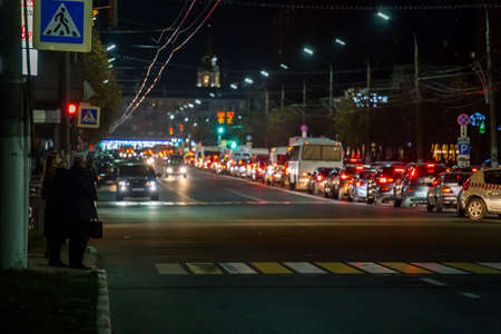 TULA, RUSSIA - OCTOBER 16, 2018: citizens waiting signal for crossing central prospect at night in...