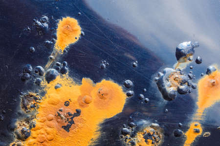 rusted through blue car surface close-up with selective focusの写真素材