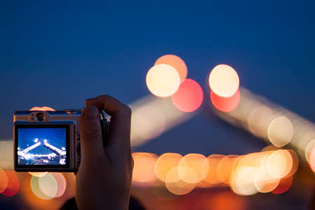Hand shooting night photo of bridge