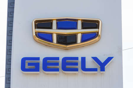Geely logo on car dealership pillar at sunny day - Geely is one of the largest Chinese automobile...