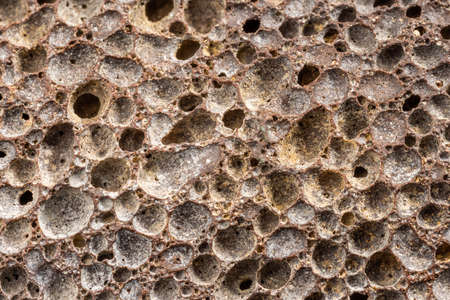 macro shot of used pumice stone with dirt and dead skin inside pores