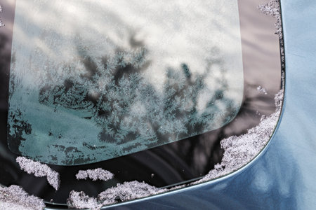 hoarfrost on car window glass at daylight close-up with selective focusの写真素材
