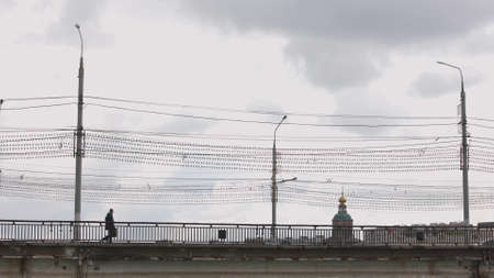 side view of cars and citizens passing over an old bridge in Tula, Russia - September 23, 2021のeditorial素材