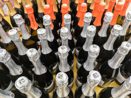 many bottles of champagne in a grocery store closeup with selective focus and wide angle in Tula, Russia - March 3, 2022のeditorial素材