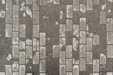 full-frame background and texture of damaged brick pavement