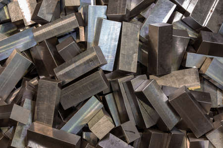 pile of cuboid steel workpieces after surface grindingの写真素材