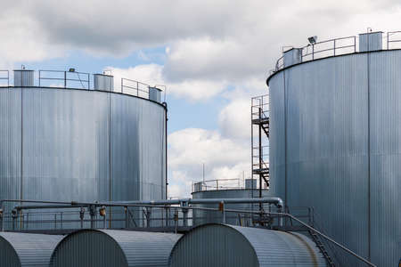 Overground thermal insulated cylindrical bitumen storage tanks.