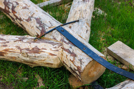 forged steel stripe connection of wooden log beams for roof support girder framework laid on green...