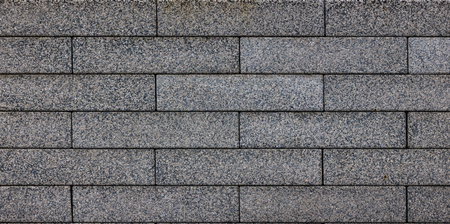 flat texture and full-frame background of gray long rectangular brick pavementの写真素材