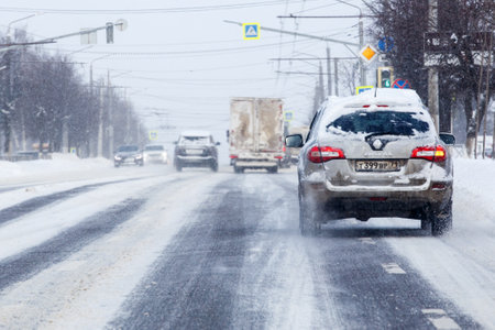 Renault Koleos car on snow covered road at winter day after snowfall in Tula, Russiaのeditorial素材