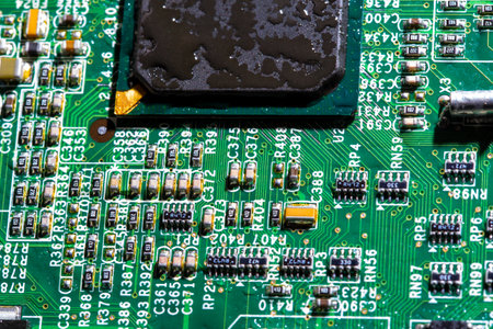 wet digital circuit board with microprocessors and components, closeup full-frame macro backgroundの写真素材