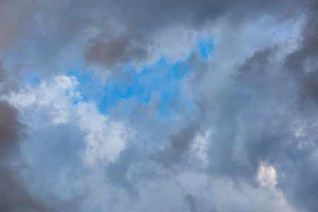 overcast sky, full-frame gray clouds background and textureの写真素材