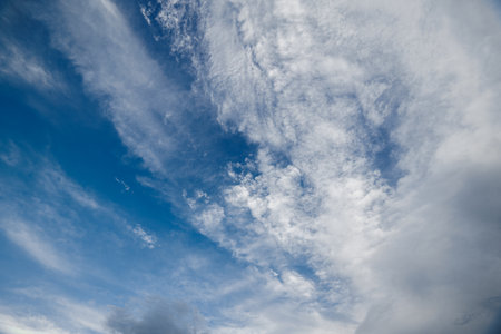 blue sky with mixed white clouds - full-frame horizonless cloudscape.の写真素材