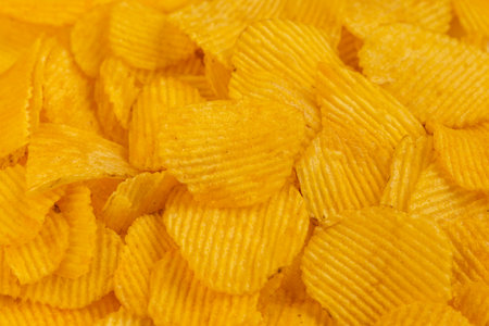 ribbed potato chips - full-frame close-up background.の写真素材