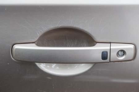 car door handle with many nail scratches under.の写真素材