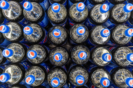 Rows of plastic Pepsi bottles, close-up full-frame high angle viewのeditorial素材