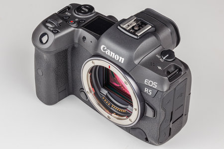 mirrorless digital camera body Canon R5 without lens on white backgroundのeditorial素材