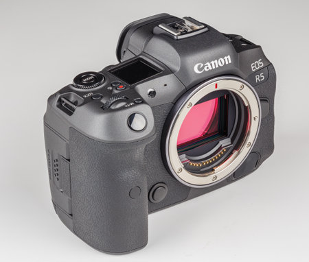 mirrorless digital camera body Canon R5 without lens on white backgroundのeditorial素材