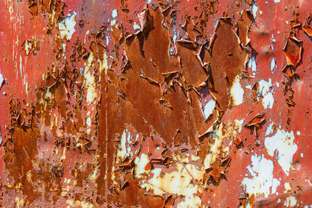 Closeup of rusty metal with peeling brown paintの写真素材