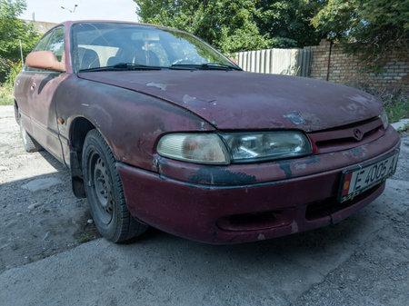 heavily used falling apart car at the street of Central Asiaのeditorial素材