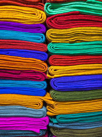 Vibrantly Colored felt Rolls are Beautifully Stacked Neatly in showcaseの写真素材